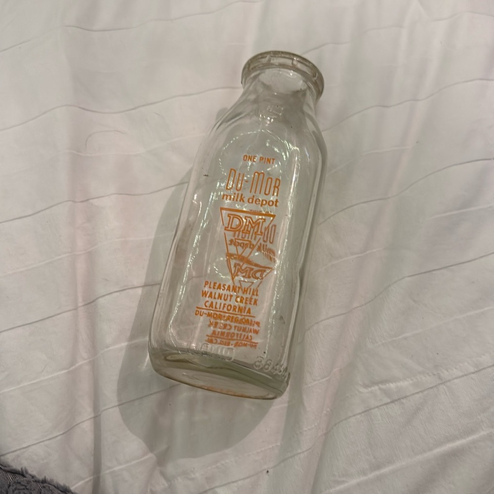 Old glass milk jar